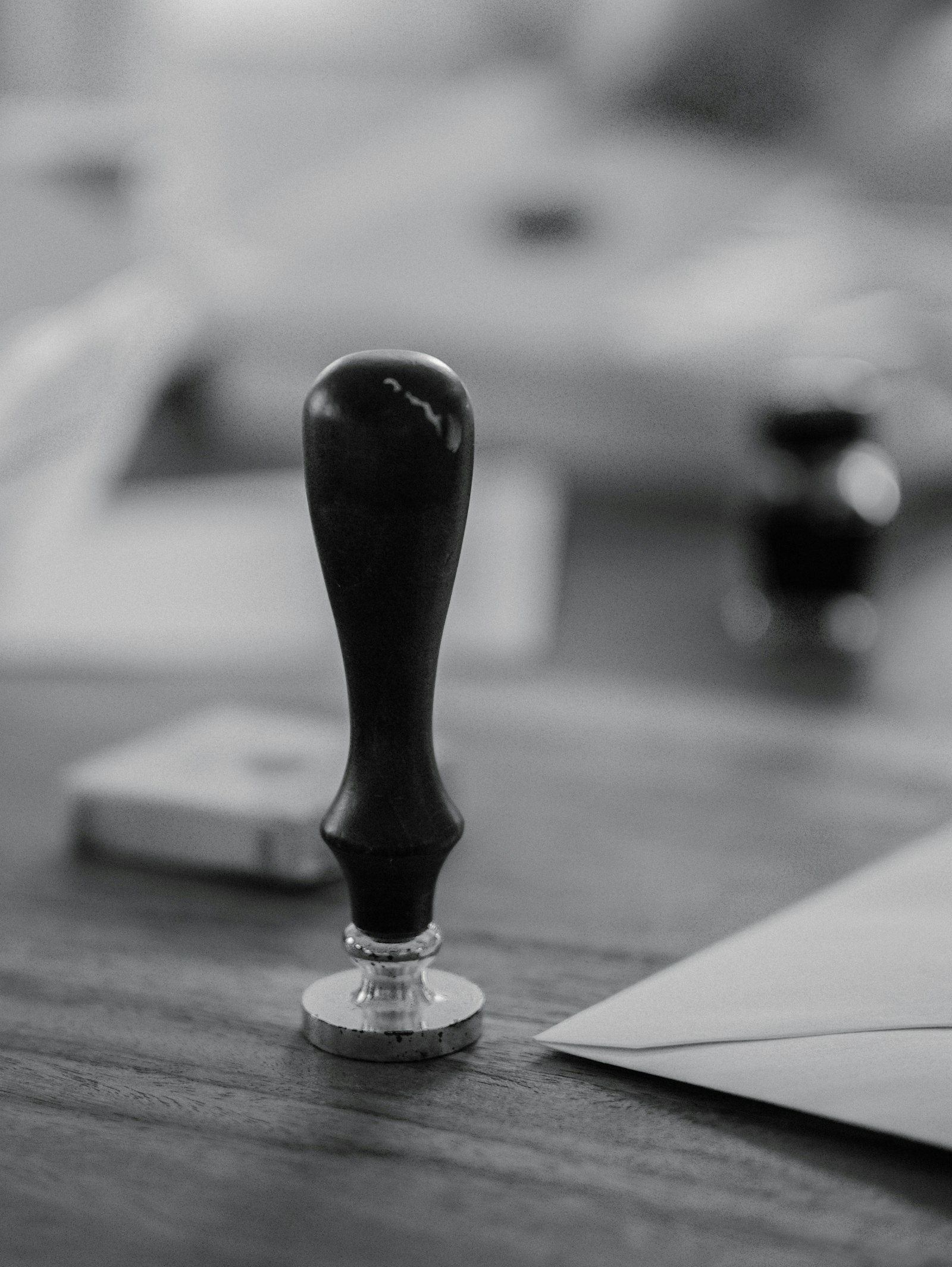 Wooden notary stamp resting on a desk