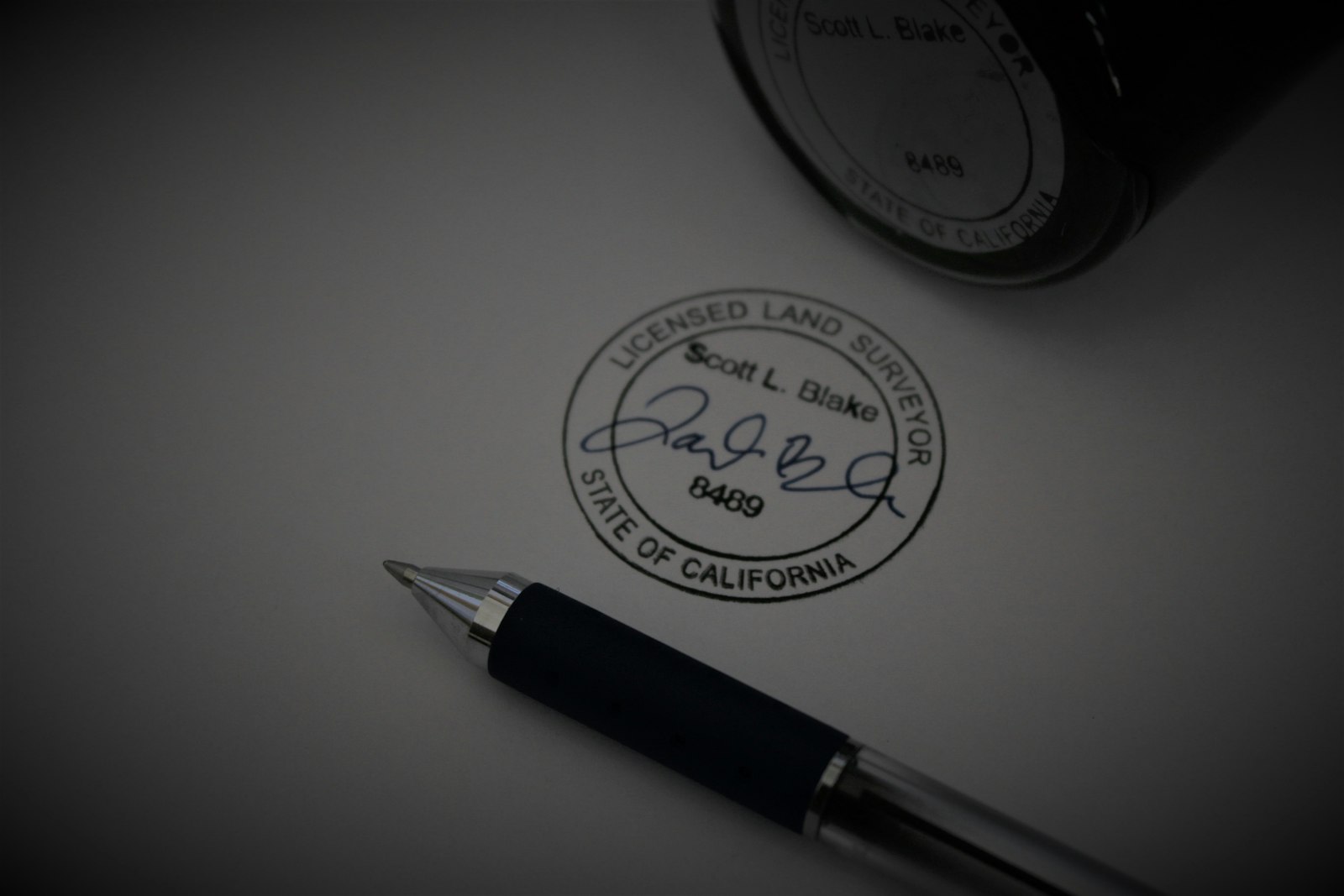 Pen resting on a document ready for signing